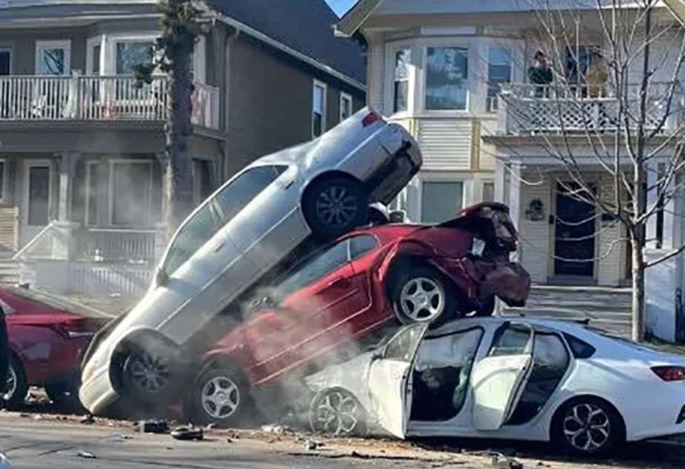 Car Crash Cars stacked on top of each other after accident