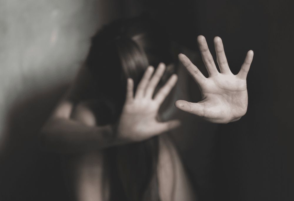 Sexual Abuse Woman raises hands in front