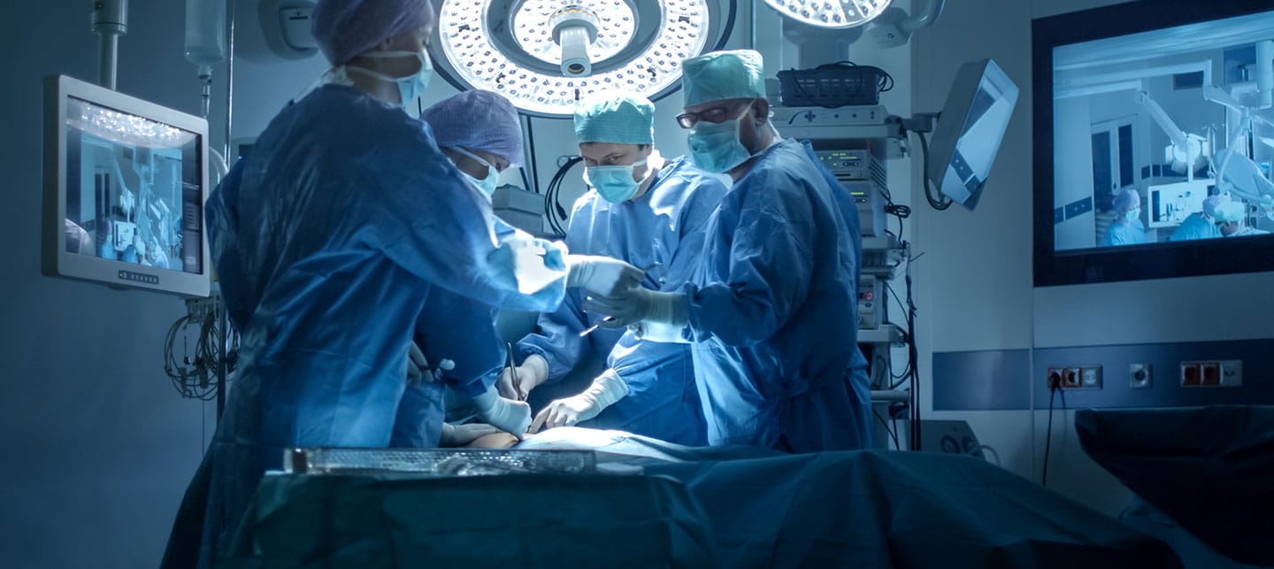 Multiple Doctors Working on a Surgery Room