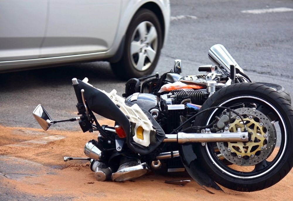 Motorbike accident scene on city road