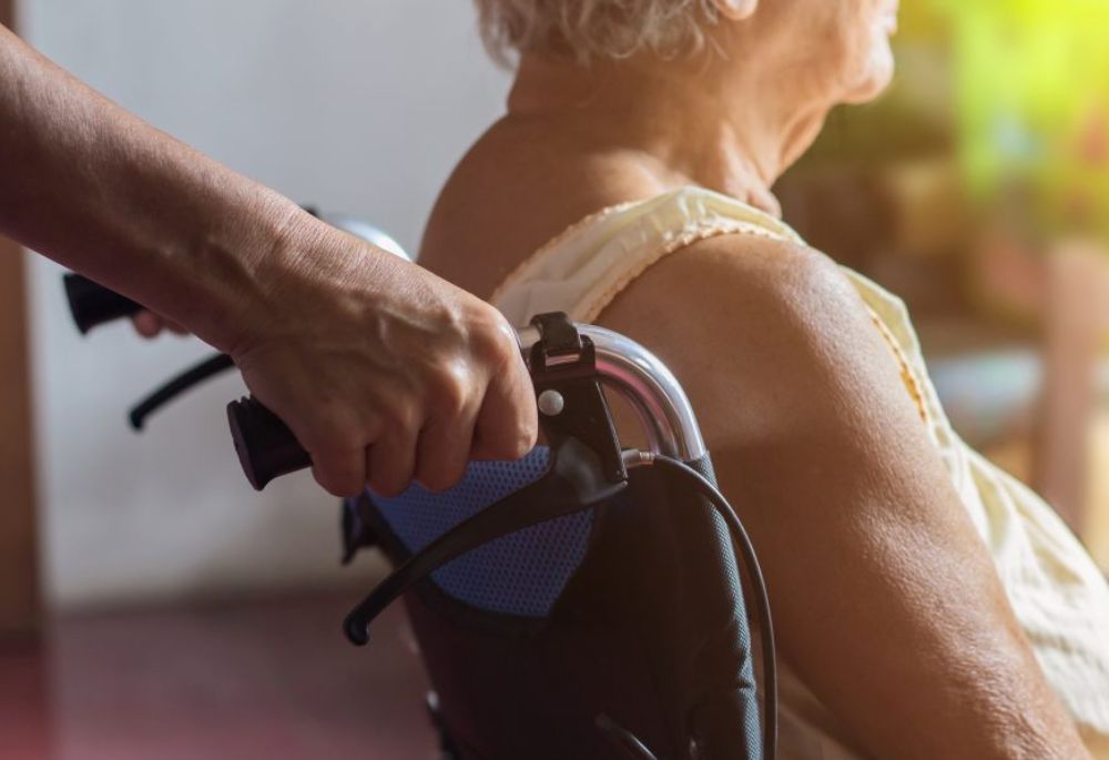 Woman on Wheelchair Senior in wheelchair nursing home care
