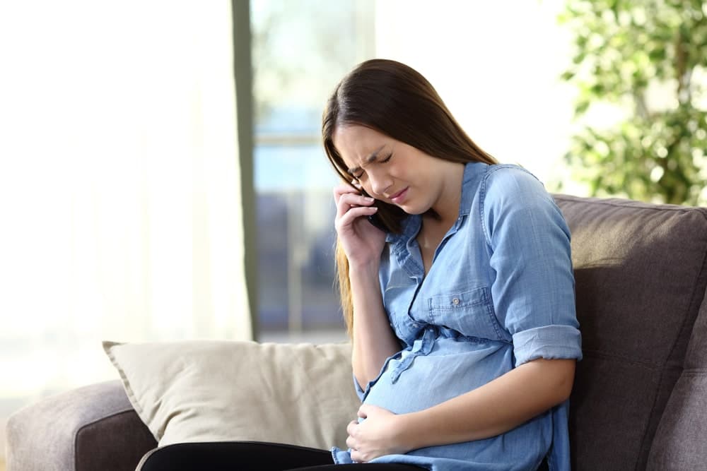 Pregnant Woman A Woman Talking On A Cell Phone
