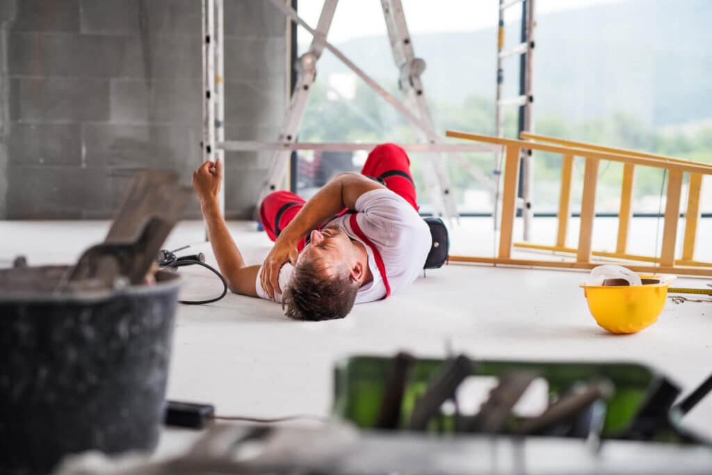 Construction Worker Laying In Pain