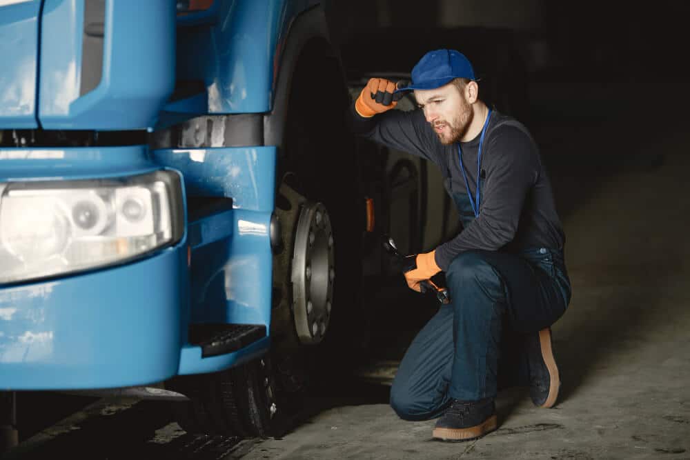Person Working on a Broken Truck