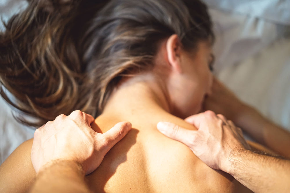 Massage Person massaging womans shoulders