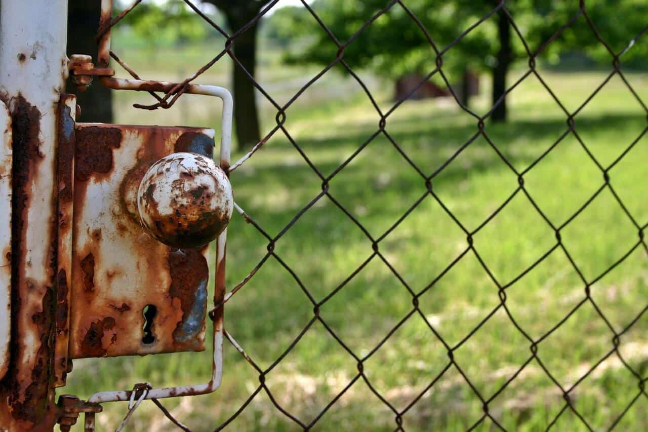 Old metal door handle for the fence