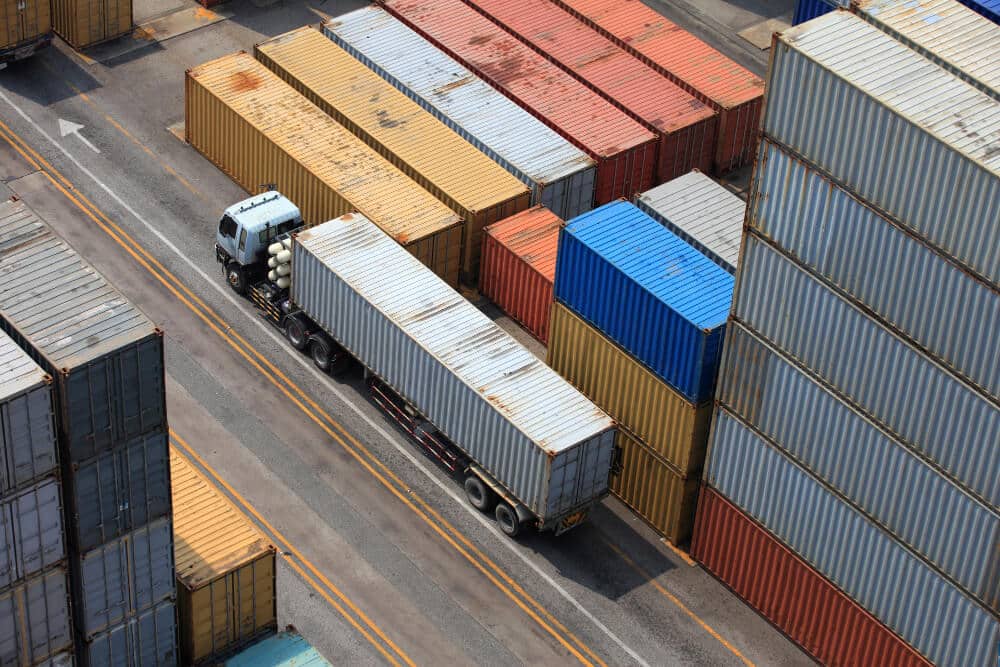 Semi Truck in a Port Getting Loaded with a Container