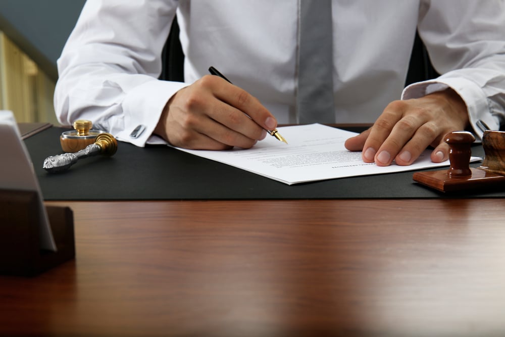 Photo of a Man With Paper