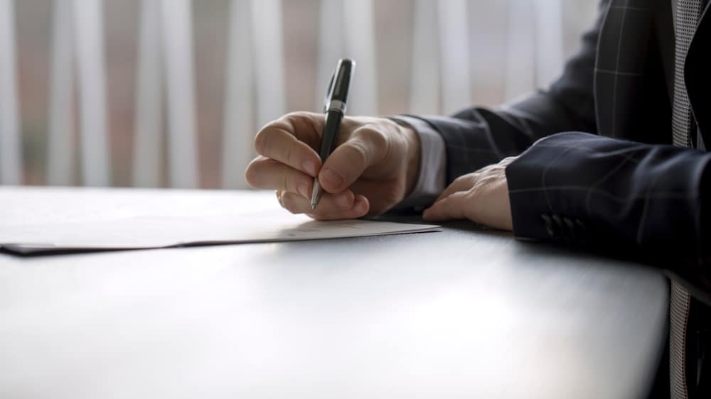 Photo of a person filling papers