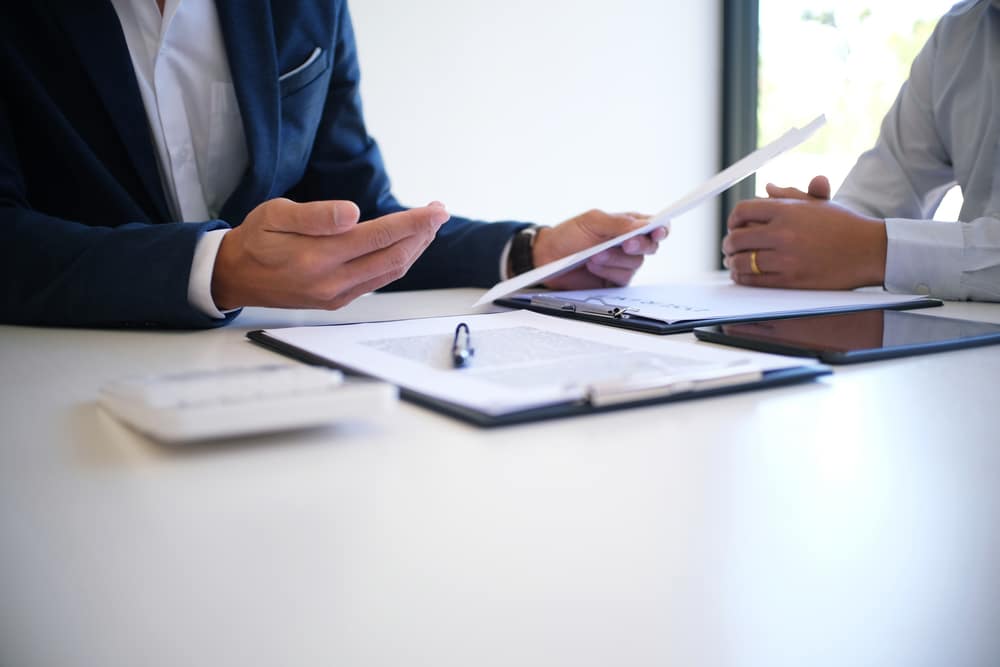 Photo of two people sitting at the table