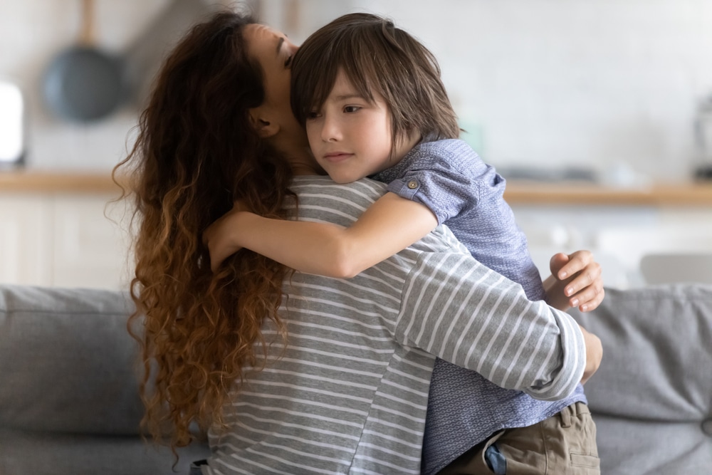 Photo of woman huging a child